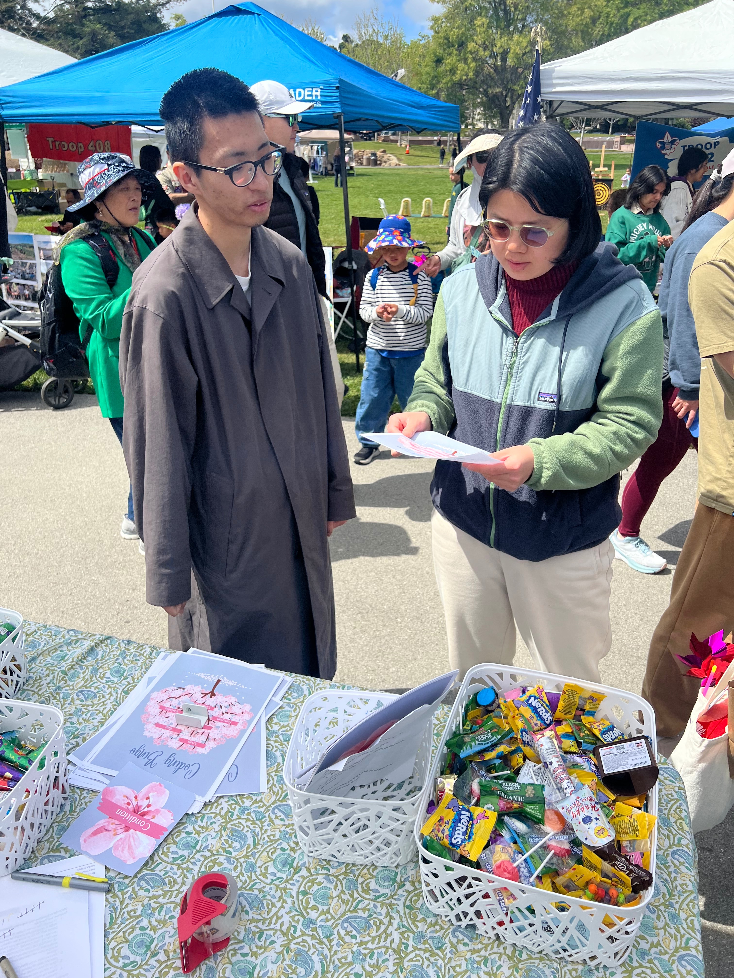 Volunteers helping families at community coding event